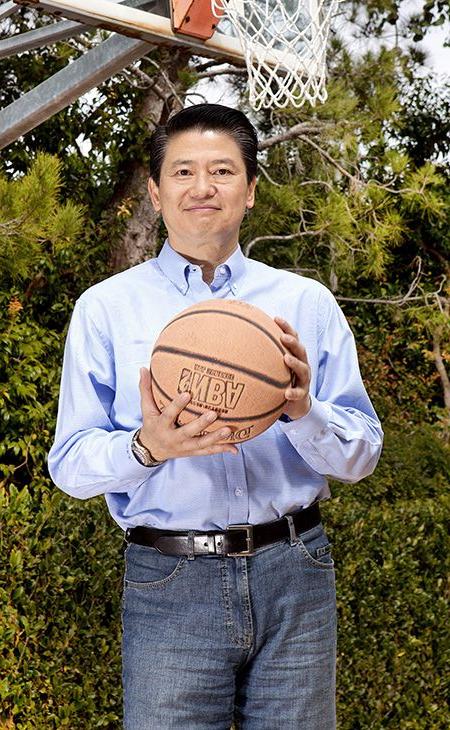 Victor Tsao standing with a basketball